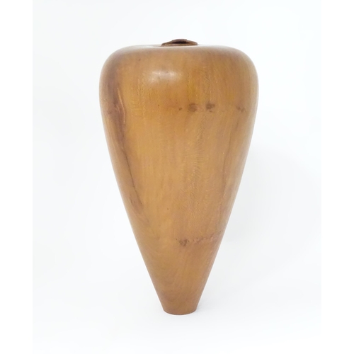 133 - A wooden vase of tapering form. Approx. 16