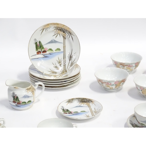 158 - A quantity of assorted Oriental ceramics decorated with dragons / landscapes, to include teapot, sug... 