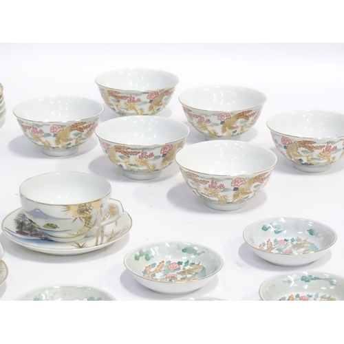 158 - A quantity of assorted Oriental ceramics decorated with dragons / landscapes, to include teapot, sug... 