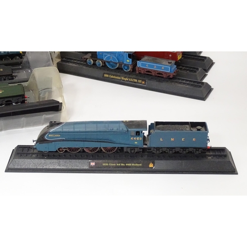 169 - Toys - Model Railway / Train Interest: A quantity of assorted display / collectors trains / locomoti... 