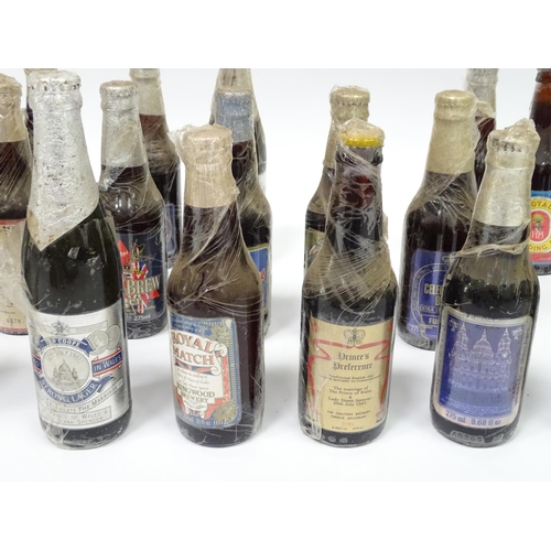 212 - A quantity of late 20thC commemorative bottles of beer / ale / bitter / lager , including brews by E... 