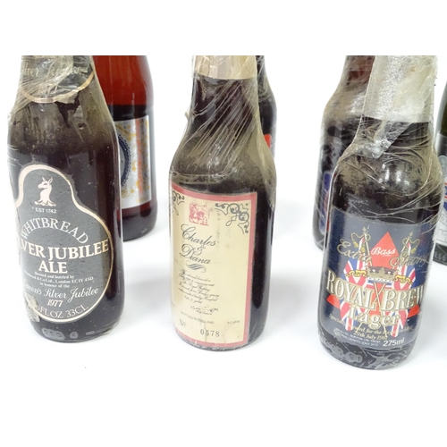 212 - A quantity of late 20thC commemorative bottles of beer / ale / bitter / lager , including brews by E... 