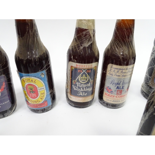 212 - A quantity of late 20thC commemorative bottles of beer / ale / bitter / lager , including brews by E... 