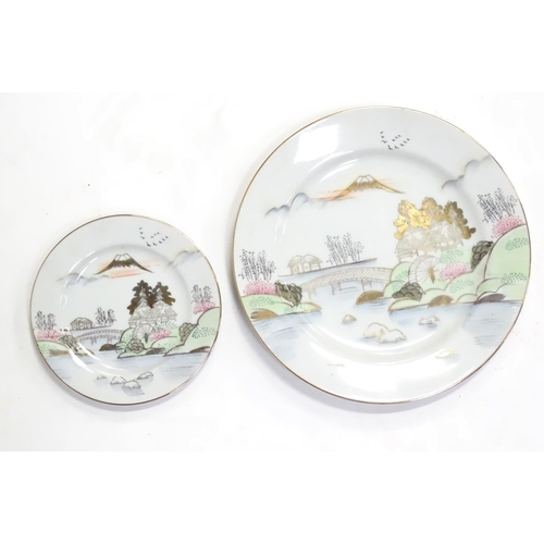 243 - A quantity of Oriental coffee / dinner wares decorated with a watermill in a landscape, to include s... 