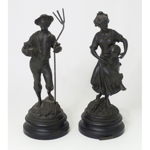 251 - Two 20thC French cast harvest figures, the female figure holding a flask, standing on a naturalistic... 