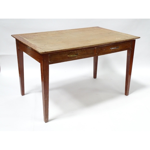 261 - A early 20thC office desk with four tapering legs. Produced by Cooke's of Finsbury. 48