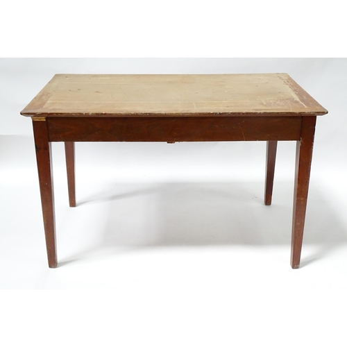 261 - A early 20thC office desk with four tapering legs. Produced by Cooke's of Finsbury. 48