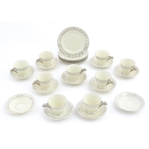 272 - A quantity of Art Deco style tea wares with banded detail comprising plates, cups and saucers. Cups ... 