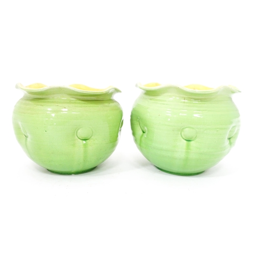 287 - Two green glazed jardinieres / planters with lobed rims and dimple detail. Approx. 7 1/2