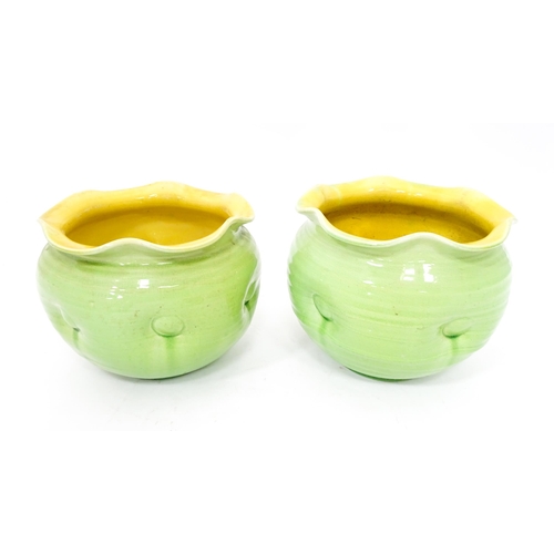 287 - Two green glazed jardinieres / planters with lobed rims and dimple detail. Approx. 7 1/2