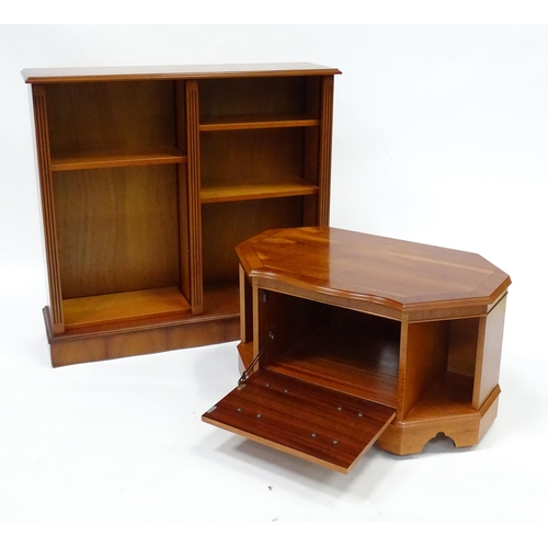 299 - A yew wood veneered bookcase and cabinet. The bookcase measuring 42