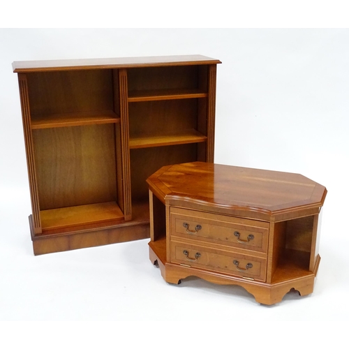 299 - A yew wood veneered bookcase and cabinet. The bookcase measuring 42