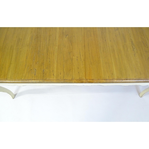 305 - A late 20thC dining table together with a set of eight dining chairs. The table having an oak top ab... 