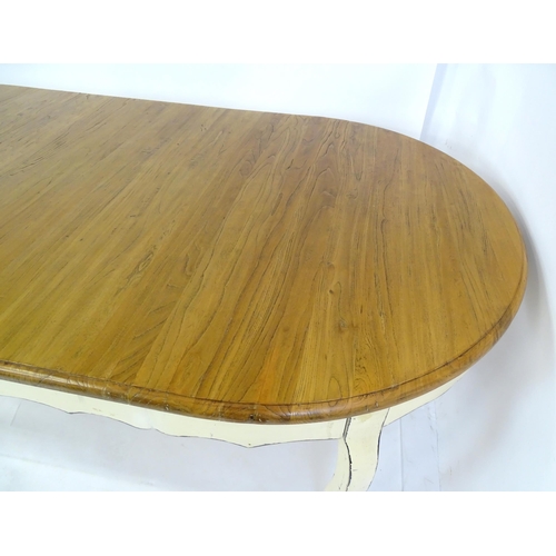 305 - A late 20thC dining table together with a set of eight dining chairs. The table having an oak top ab... 