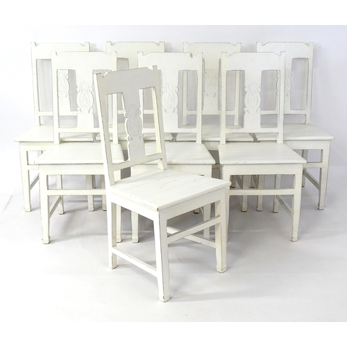 305 - A late 20thC dining table together with a set of eight dining chairs. The table having an oak top ab... 