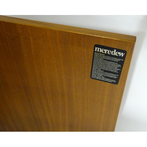 355 - Vintage / Retro: A teak sideboard by Meredew, having fitted storage shelves within alcoves,  a glaze... 