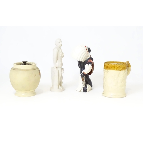 390 - Three ceramic items comprising a two tone tankard with relief detail, tobacco jar, and a Native Amer... 