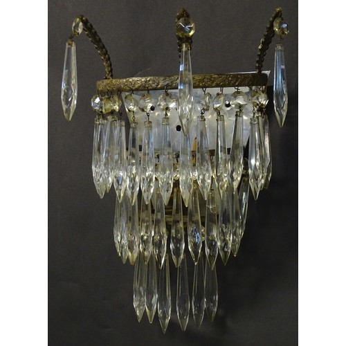 401 - A pair of three tier wall lights with lustre drops and floral and foliate gilt metal detail. Approx.... 