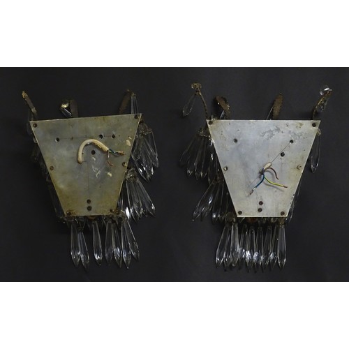 401 - A pair of three tier wall lights with lustre drops and floral and foliate gilt metal detail. Approx.... 