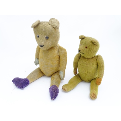 421 - Toys: An early 20thC straw filled teddy bear with glass eyes, stitched nose and mouth and growler me... 