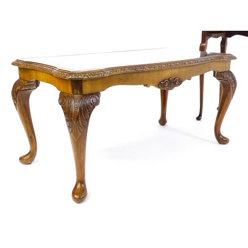 437 - Two burr walnut veneered tables, one a side  table raised on four shell carved legs with a shaped to... 