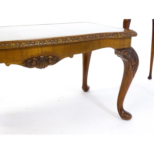 437 - Two burr walnut veneered tables, one a side  table raised on four shell carved legs with a shaped to... 