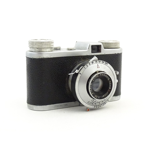 443 - A quantity of 20thC cameras and camera accessories to include a Kodak Retinette 35mm camera with box... 