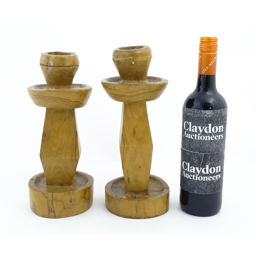 452 - A pair of naive carved fruitwood candlesticks. Approx. 11 1/2