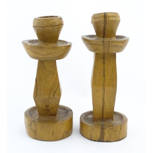 452 - A pair of naive carved fruitwood candlesticks. Approx. 11 1/2