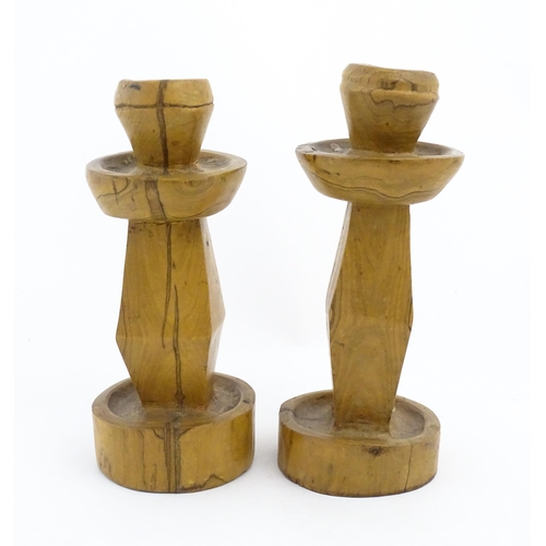 452 - A pair of naive carved fruitwood candlesticks. Approx. 11 1/2