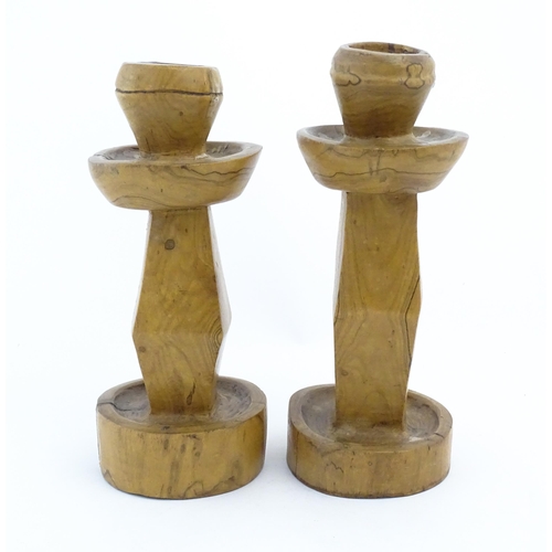 452 - A pair of naive carved fruitwood candlesticks. Approx. 11 1/2