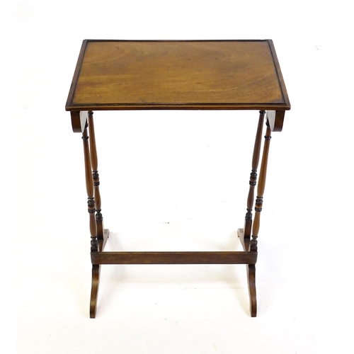 472 - A 19thC mahogany side table with turned tapering supports above shaped feet. 20