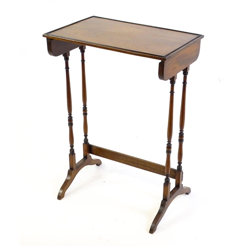 472 - A 19thC mahogany side table with turned tapering supports above shaped feet. 20