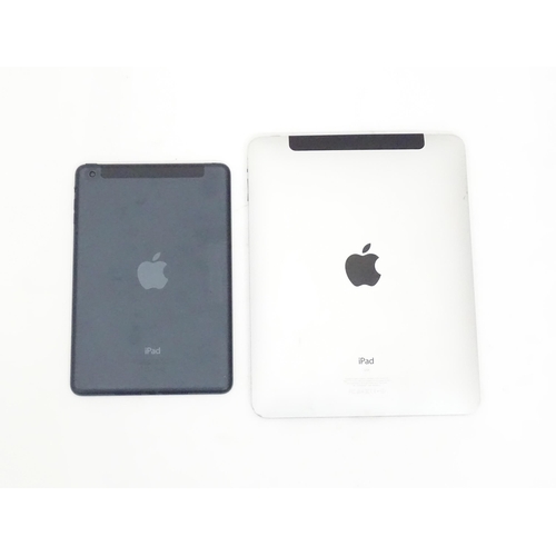 490 - Two Apple iPads to comprising a silver iPad Model A1337 and a black iPad Mini Model A1455 (2)