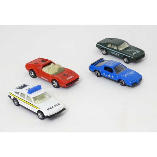 495 - Toys: Four small Corgi die cast scale model vehicles comprising Jaguar Track Car, Ferrari 308 GTS, R... 