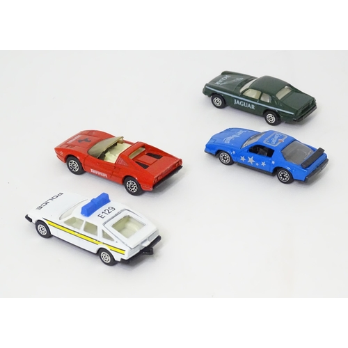 495 - Toys: Four small Corgi die cast scale model vehicles comprising Jaguar Track Car, Ferrari 308 GTS, R... 