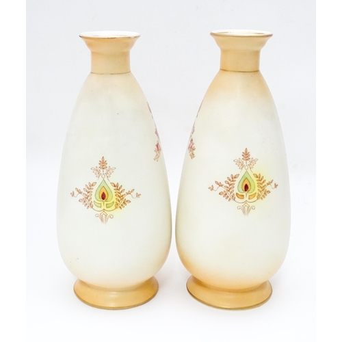 823 - A pair of Crown Devon vases in the Etna pattern. Marked under. Approx. 9 1/2