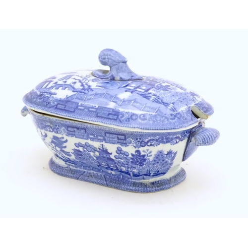 824 - Two items of blue and white to include a Spode pearlware sauce tureen and a shaped dish. Dish approx... 