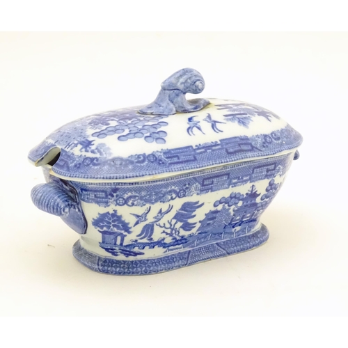 824 - Two items of blue and white to include a Spode pearlware sauce tureen and a shaped dish. Dish approx... 