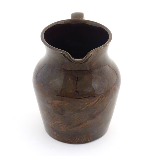 827 - An agate wear jug with loop handle. Approx. 4 1/2