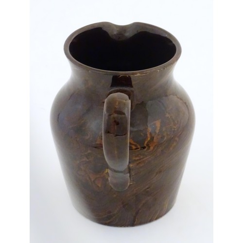 827 - An agate wear jug with loop handle. Approx. 4 1/2