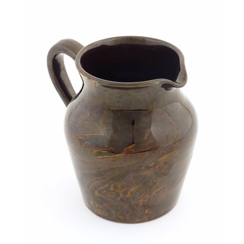 827 - An agate wear jug with loop handle. Approx. 4 1/2