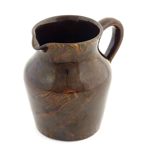 827 - An agate wear jug with loop handle. Approx. 4 1/2