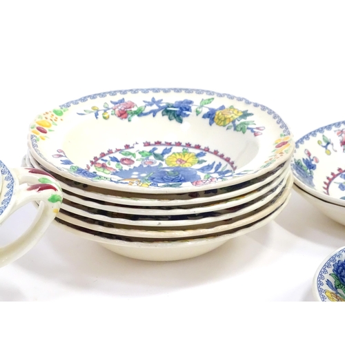 103 - A quantity of Masons dinner wares decorated in the Regency pattern to include plates, bowls, tureens... 