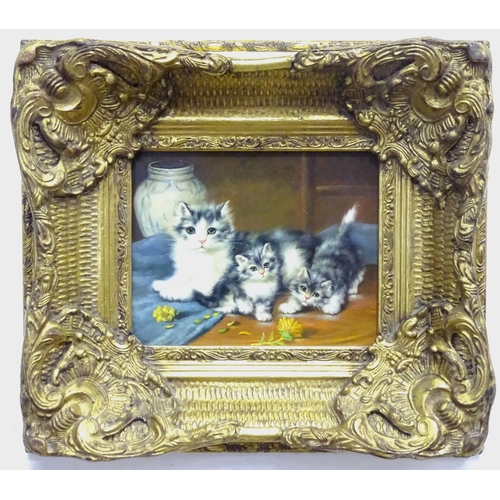 123 - A 20thC oil on board depicting a cat and kittens with a flower and vase. Frame approx. 15 3/4