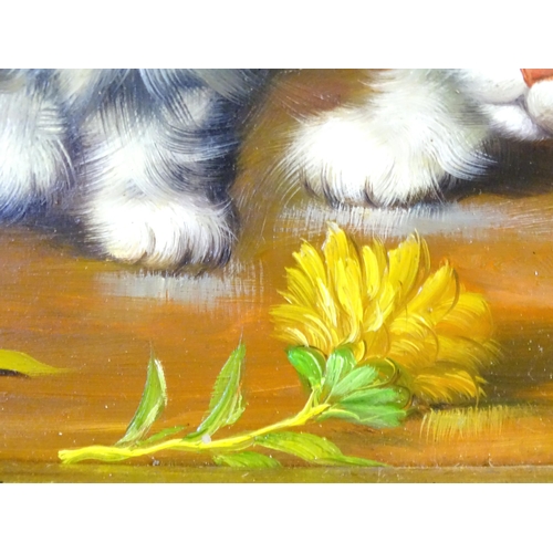 123 - A 20thC oil on board depicting a cat and kittens with a flower and vase. Frame approx. 15 3/4