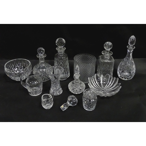 124 - A quantity of assorted glassware and cut crystal to include decanters, bowls, vase, etc. Largest dec... 