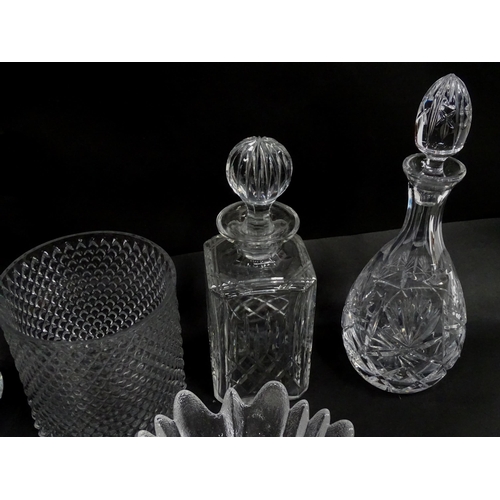 124 - A quantity of assorted glassware and cut crystal to include decanters, bowls, vase, etc. Largest dec... 