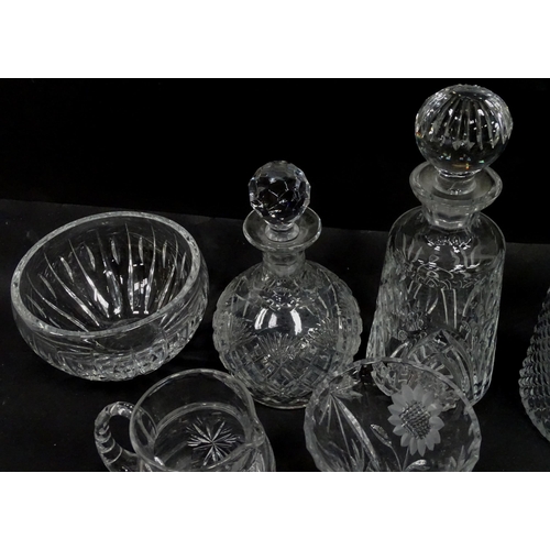 124 - A quantity of assorted glassware and cut crystal to include decanters, bowls, vase, etc. Largest dec... 