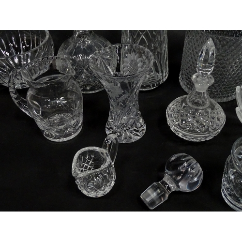 124 - A quantity of assorted glassware and cut crystal to include decanters, bowls, vase, etc. Largest dec... 